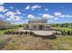 Large brick home with covered porch and patio at 610 Blaise Ct, Matthews, NC 28104