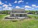 Expansive backyard with manicured landscaping and large brick home at 610 Blaise Ct, Matthews, NC 28104