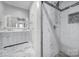 Bright bathroom boasts marble floors and a glass enclosed shower with dual shower heads at 610 Blaise Ct, Matthews, NC 28104