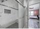 This bathroom offers a glass enclosed shower and a view into the adjacent bedroom at 610 Blaise Ct, Matthews, NC 28104