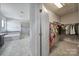 Bright view into bathroom and walk-in closet highlights neutral colors and finishes at 610 Blaise Ct, Matthews, NC 28104