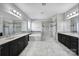 This bathroom offers double vanity, large bathtub, and glass shower at 610 Blaise Ct, Matthews, NC 28104