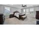Relaxing bedroom features a large bed, neutral walls, and plenty of natural light at 610 Blaise Ct, Matthews, NC 28104