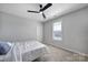Bedroom with carpet, ceiling fan and window with blinds at 610 Blaise Ct, Matthews, NC 28104