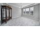Elegant dining room featuring tiled floors, decorative chandelier, and bright windows with lots of natural light at 610 Blaise Ct, Matthews, NC 28104