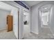 Hallway view into office space showcases neutral walls and carpet at 610 Blaise Ct, Matthews, NC 28104