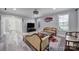 Comfortable living room featuring modern decor, large windows, and lots of natural light at 610 Blaise Ct, Matthews, NC 28104