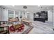 Open concept living area flowing into a kitchen with stainless steel appliances and tile flooring at 610 Blaise Ct, Matthews, NC 28104