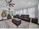 Living room with ceiling fan and large windows at 610 Blaise Ct, Matthews, NC 28104