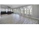 Spacious living room with a wall of windows and access to the backyard at 610 Blaise Ct, Matthews, NC 28104