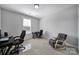 Light and airy office space features neutral walls and plenty of natural light at 610 Blaise Ct, Matthews, NC 28104