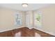 Bright bedroom features hardwood floors and two windows with natural light at 612 Rowan Mill Rd, Salisbury, NC 28147