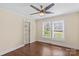 Bright bedroom with natural light, hardwood floors, and vintage door at 612 Rowan Mill Rd, Salisbury, NC 28147