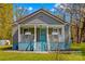A cozy home with a covered porch, landscaped yard, and charming curb appeal at 612 Rowan Mill Rd, Salisbury, NC 28147