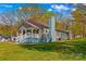 Charming home with a welcoming front porch, lovely lawn, and cozy aesthetic at 612 Rowan Mill Rd, Salisbury, NC 28147