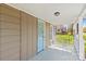 A quaint covered front porch with seating area and inviting entryway at 612 Rowan Mill Rd, Salisbury, NC 28147