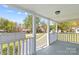 An inviting covered front porch with views of the neighborhood and ample space at 612 Rowan Mill Rd, Salisbury, NC 28147
