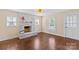 Inviting living room with hardwood floors, brick fireplace, and natural light at 612 Rowan Mill Rd, Salisbury, NC 28147