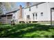 Large, grassy backyard features a wooden deck and a play structure at 6718 Rollingridge Dr, Charlotte, NC 28211