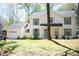Charming two-story home featuring blue shutters, a front yard, and an attached garage at 6718 Rollingridge Dr, Charlotte, NC 28211