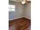 Bright bedroom featuring hardwood floors, a ceiling fan, and ample natural light at 736 Lawndale Cir, Fort Lawn, SC 29714