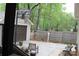 Enjoy the backyard with a basketball hoop, patio, and convenient access to the garage and outdoor spaces at 7626 Surreywood Pl, Charlotte, NC 28270