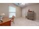 Bright bedroom with a natural light, a vintage chair, side table, and a wardrobe for storage at 7626 Surreywood Pl, Charlotte, NC 28270