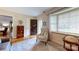 Inviting entryway with hardwood floors, neutral tones, stylish decor, and cozy seating area at 7626 Surreywood Pl, Charlotte, NC 28270