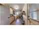 Spacious laundry room with washer, dryer, storage shelves, utility sink, and ample counter space at 7626 Surreywood Pl, Charlotte, NC 28270