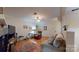 Comfortable living room features hardwood floors, neutral tones, ceiling fan, and relaxing atmosphere at 7626 Surreywood Pl, Charlotte, NC 28270