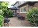 Backyard patio featuring gravel, lush landscaping, outdoor seating and gas fire pit at 801 Berkeley Ave, Charlotte, NC 28203