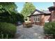 Backyard patio featuring a dining table, lush landscaping and grill at 801 Berkeley Ave, Charlotte, NC 28203