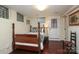 Basement bedroom with vintage bed, white painted brick and glass block windows at 801 Berkeley Ave, Charlotte, NC 28203