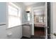 Bright bathroom with subway tile, vanity, and view into a bedroom at 801 Berkeley Ave, Charlotte, NC 28203
