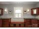 Well-lit bathroom features dual vanities, marble backsplash, and stylish sconces for a classic look at 801 Berkeley Ave, Charlotte, NC 28203