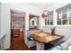 Cozy breakfast nook featuring built-in seating, a pendant light, and a view into the kitchen at 801 Berkeley Ave, Charlotte, NC 28203