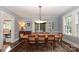 Elegant dining room with hardwood floors, large windows, and adjacent outdoor access at 801 Berkeley Ave, Charlotte, NC 28203