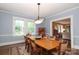 Spacious dining room with hardwood floors, large table, and plenty of natural light at 801 Berkeley Ave, Charlotte, NC 28203