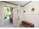 Charming entryway featuring slate tile, a bench, and views of the landscaped front yard through the front door at 801 Berkeley Ave, Charlotte, NC 28203