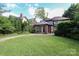 Beautiful home featuring a covered front porch and lush landscaping, creating a welcoming curb appeal at 801 Berkeley Ave, Charlotte, NC 28203