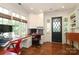 Bright home office with built-in desk, cabinetry, large window and hardwood floors at 801 Berkeley Ave, Charlotte, NC 28203