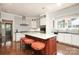 Spacious kitchen featuring a center island with seating and stainless steel appliances at 801 Berkeley Ave, Charlotte, NC 28203