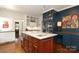 Kitchen island with marble countertop and cabinetry, plus built-in storage and designer accents at 801 Berkeley Ave, Charlotte, NC 28203