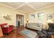 Elegant living room with coffered ceilings and classic furniture, plus a view to another room at 801 Berkeley Ave, Charlotte, NC 28203
