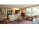 Bright living room with hardwood floors, large windows, and classic furnishings at 801 Berkeley Ave, Charlotte, NC 28203