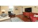 Relaxing living room featuring natural light, wood floors, and comfortable seating arrangement at 801 Berkeley Ave, Charlotte, NC 28203