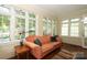 Bright living room with large windows providing ample natural light and a cozy seating area at 801 Berkeley Ave, Charlotte, NC 28203