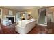 Comfortable living room featuring hardwood floors, fireplace, and adjacent room with glass doors at 801 Berkeley Ave, Charlotte, NC 28203