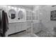 Modern bathroom featuring a double vanity, stylish lighting, and a glass-enclosed shower at 801 Celbridge Ct, Charlotte, NC 28270