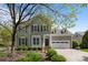 Charming two-story home featuring manicured landscaping, a two-car garage, and classic architectural details at 801 Celbridge Ct, Charlotte, NC 28270